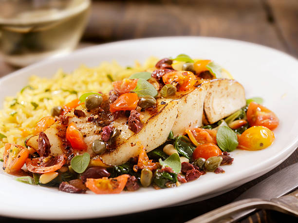 istock Grilled Halibut with Capers,Olives and Tomatoes 506765640