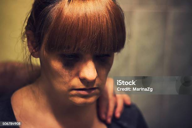 Comforting Hand On A Shoulder Of Crying Abused Woman Stock Photo - Download Image Now