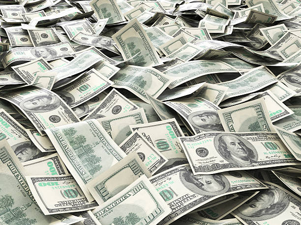 istock One hundred dollars pile as background. 506786074