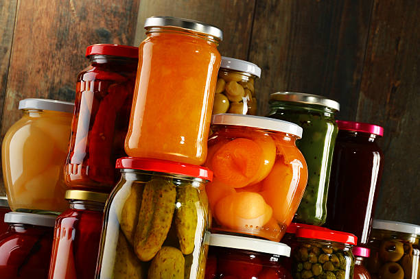istock Jars with pickled vegetables, fruity compotes and jams 506787436