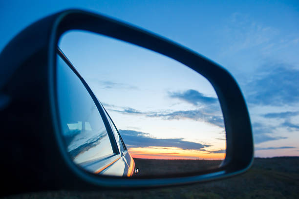 istock Blue landscape sunset reflect in mirror of car 506789664