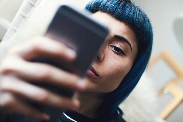 istock Young woman using smartphone at home 506790748