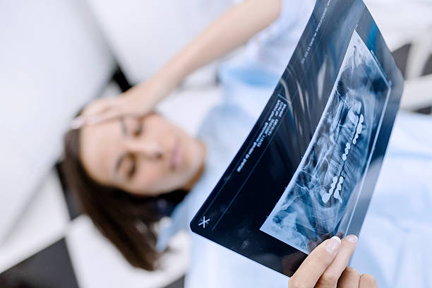 istock Terrified female patient at the dentist office 506791542