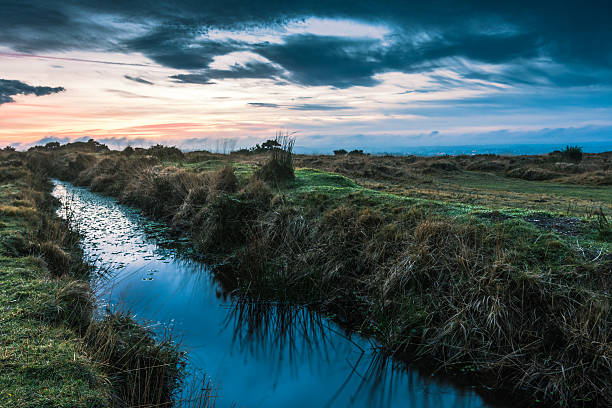 istock Dramatic sunset reflect in wild creek water 506792652