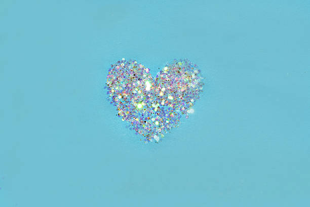 istock Abstract heart of white glitter sparkle on blue background 506793586