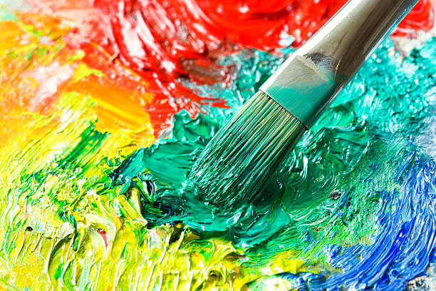 istock Paintbrush with oil paint on a classical palette 506793969