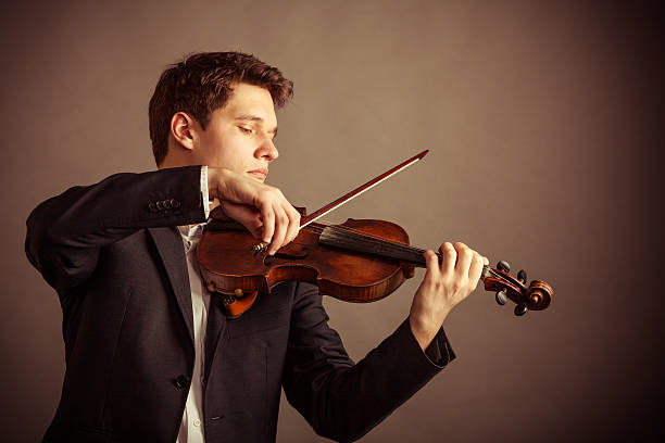 istock Man violinist playing violin. Classical music art 506794277