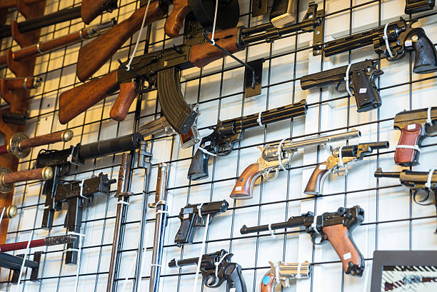 Barcelona, Spain - June 18, 2014: old weapons on a market stall in the most famous flea market in Barcelona, also known as Els Encants or Els Encants Vells, located in Glories neighborhood.