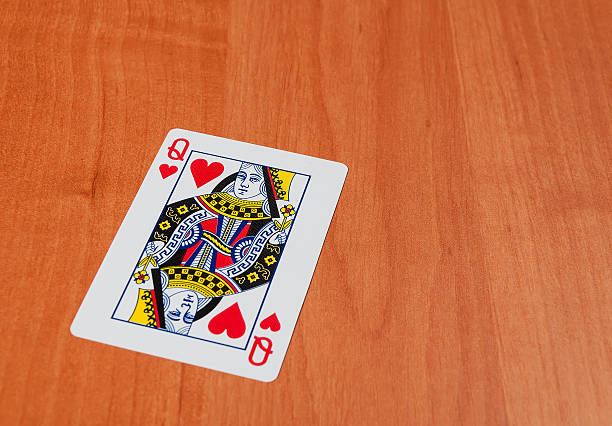 istock Playing cards on wooden table, closeup 506795138