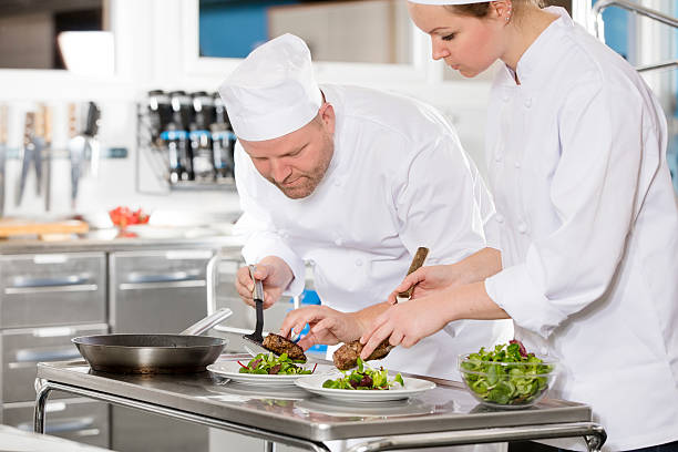 istock Professional chefs prepare steak dish at restaurant 506795548