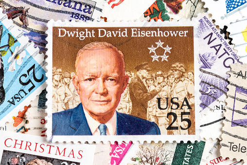 Miami, Florida, USA - June 6, 2015: Cancelled Stamp From The United States Featuring The 34th President Of The USA, Dwight D. Eisenhower on an assorted used US stamps background