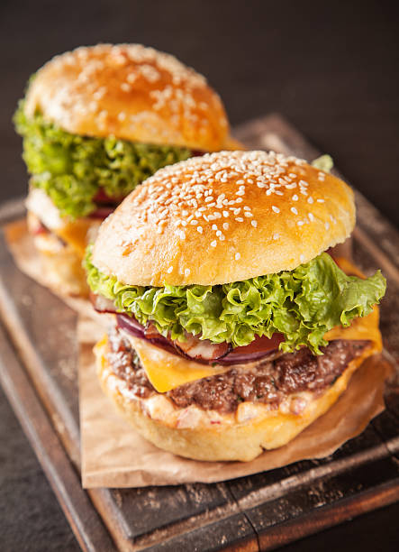 istock Fresh hamburgers on black stone 506796665