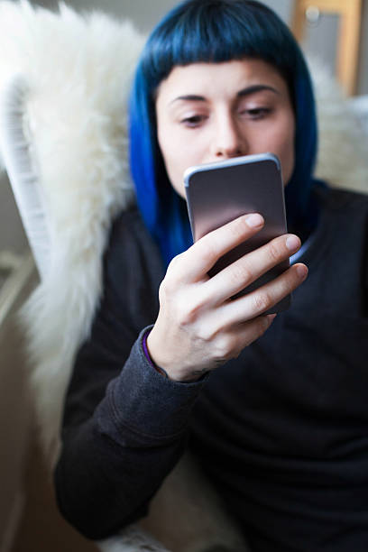 istock Young woman using smartphone at home 506797126