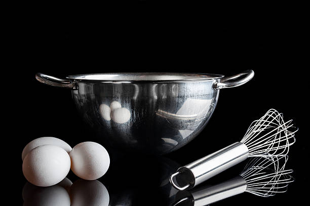 istock Steel bowl whisker eggs from side on black 506797306