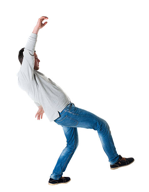 Back view man Balances waving his arms. Back view man Balances waving his arms. Rear view people collection. backside view of person. Isolated over white background. A guy in a gray jacket slipped pics of girls buttocks stock pictures, royalty-free photos & images