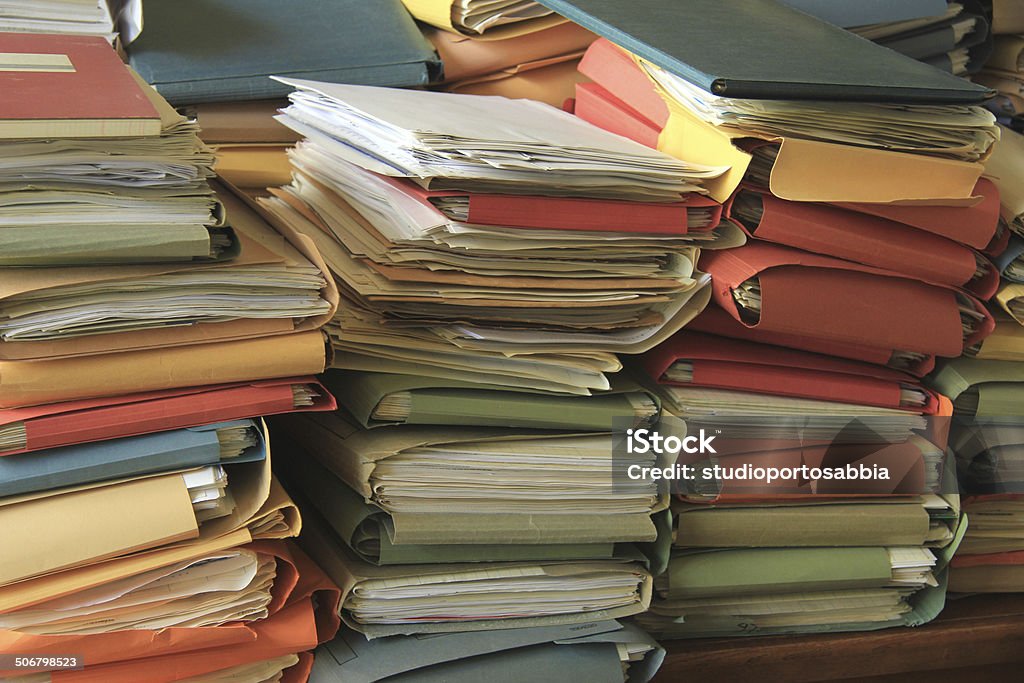 Stacked files Stacked office files: pile of paperwork in an office Bureaucracy Stock Photo