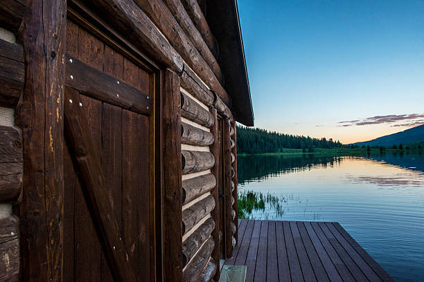 Cabin and Mountain reflection on lake in Colorado