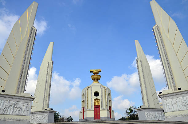 istock Democracy of Monument and  four wing-like structures which guard 506798589
