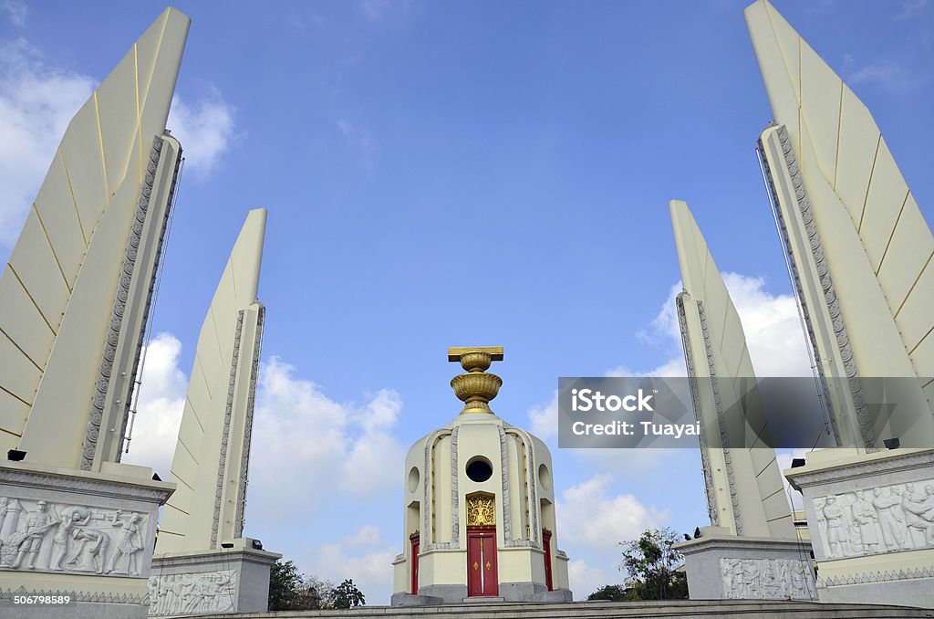 Democracy of Monument and  four wing-like structures which guard Democracy of Monument and  four wing-like structures which guard the Constitution, Situated on a traffic circle on Ratchadamnoen Klang at Bangkok Thailand. Architecture Stock Photo