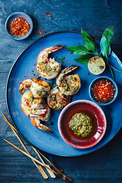 Shrimp satay Shrimp satay with pesto and chili sauces prawn seafood stock pictures, royalty-free photos & images