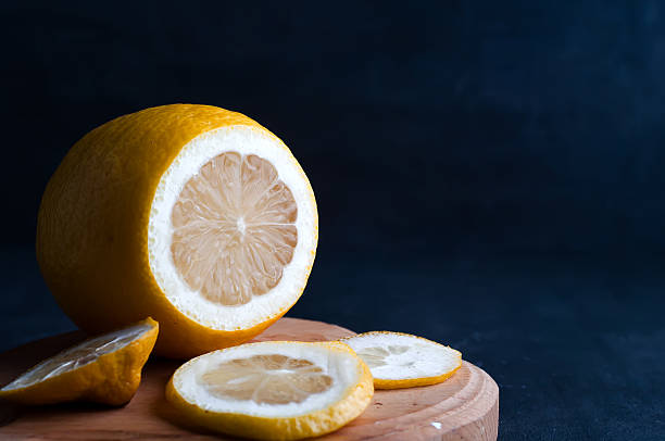 istock lemon slices on a dark background 506799586