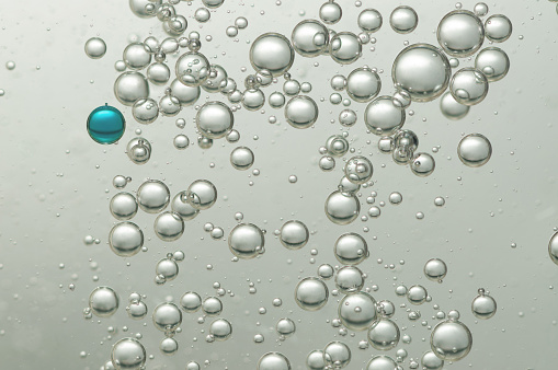 Many small oxygen bubbles floating in water