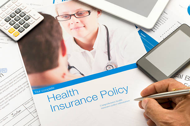 istock Health Insurance Policy brochure with paperwork. 506813474