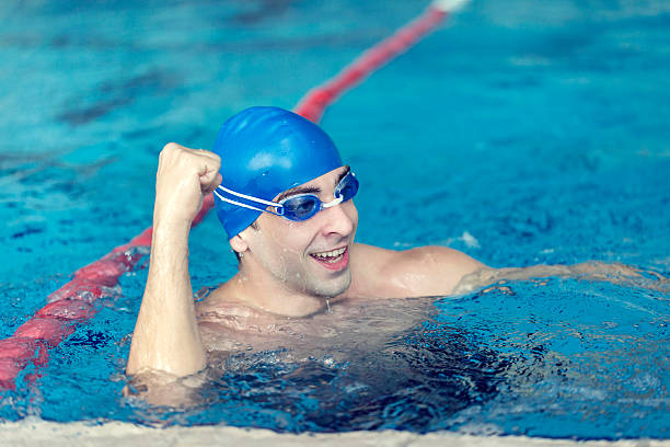 istock Swimmer cheering in the pool 506814304