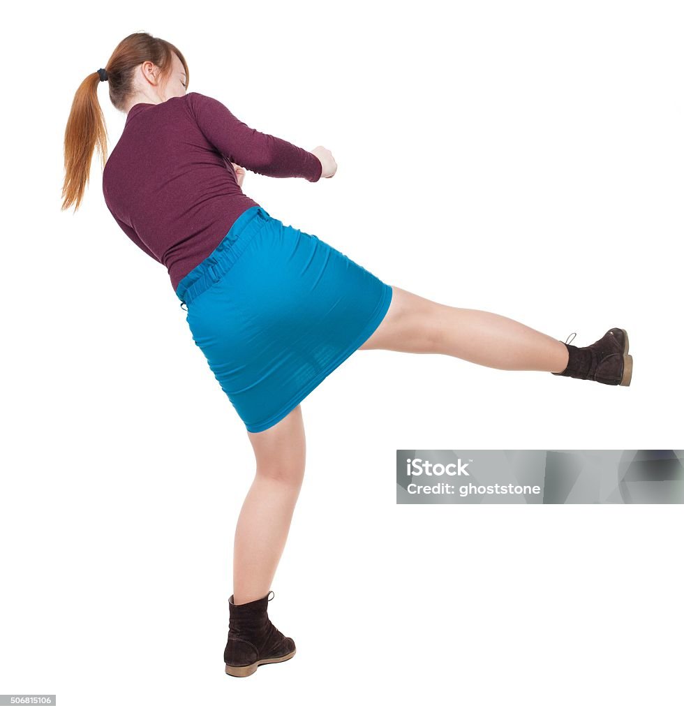 skinny woman funny fights waving his arms and legs. skinny woman funny fights waving his arms and legs. Rear view people collection.  backside view of person.  Isolated over white background. Angry woman in a fight. Adult Stock Photo