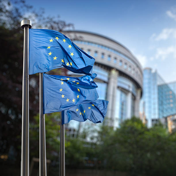 European Union flags in front of the Berlaymont stock photo