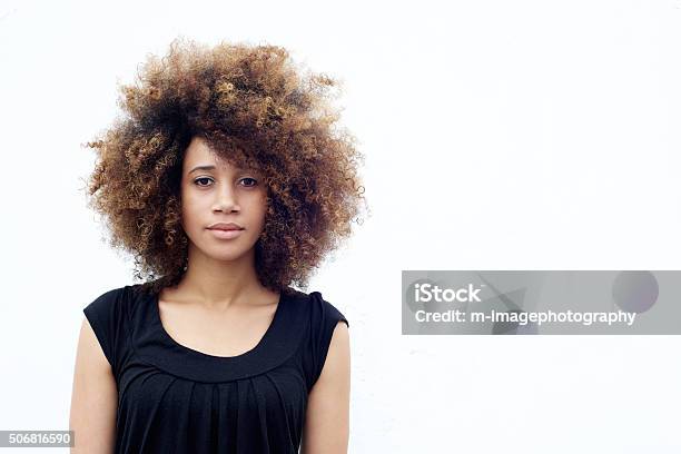 Young African Woman With Curly Hair Stock Photo - Download Image Now - Women, White Background, One Woman Only