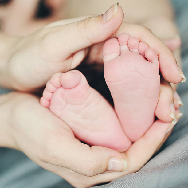 istock baby feet closeup 506816980