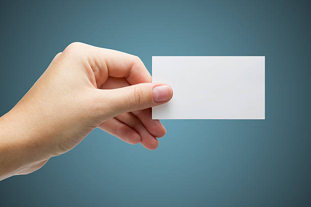 istock Hand holding white blank business visit card, gift, ticket, pass 506817290