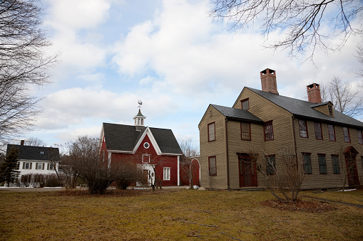 Wiscasset, Maine, USA -- January 12, 2016: Historic houses in Wiscasset, Maine located along scenic coastal route U.S. 1. All three houses are all different in architecture, color and style and were built in the middle of 19th century.