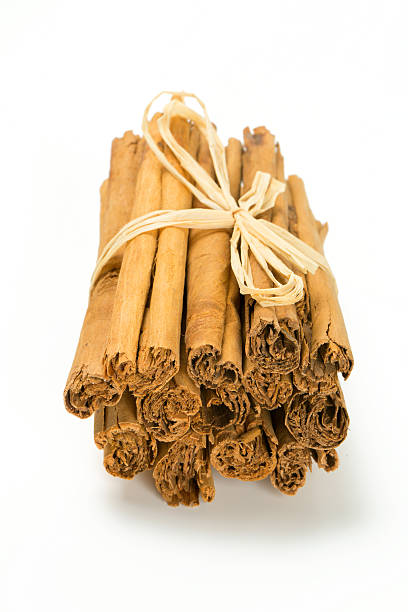istock ceylon cinnamon sticks tied up on white background 506818158
