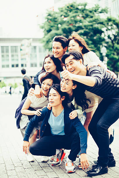 istock Young people hanging out against cityscape 506818858