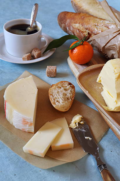 istock Cop of coffee, baguette, solig cheese and butter 506820564