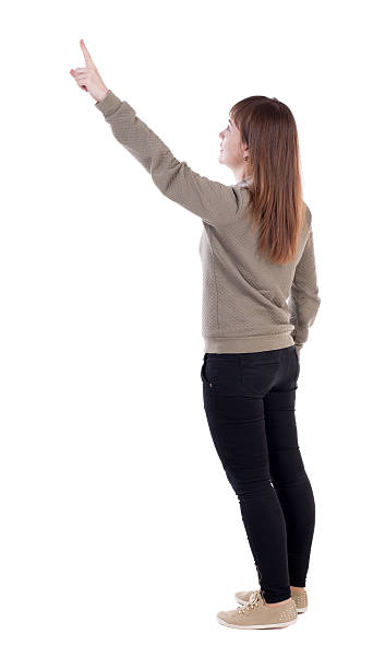 istock Back view of  pointing woman. 506820652