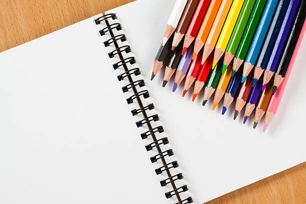 istock Watercolor pencils and blank sketchbook 506821008