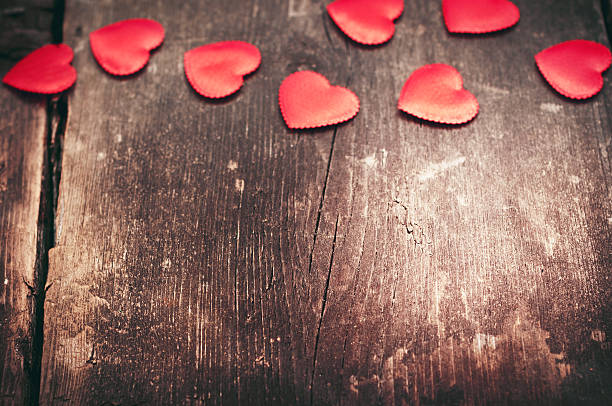 istock Red hearts on the old dark boards 506821596