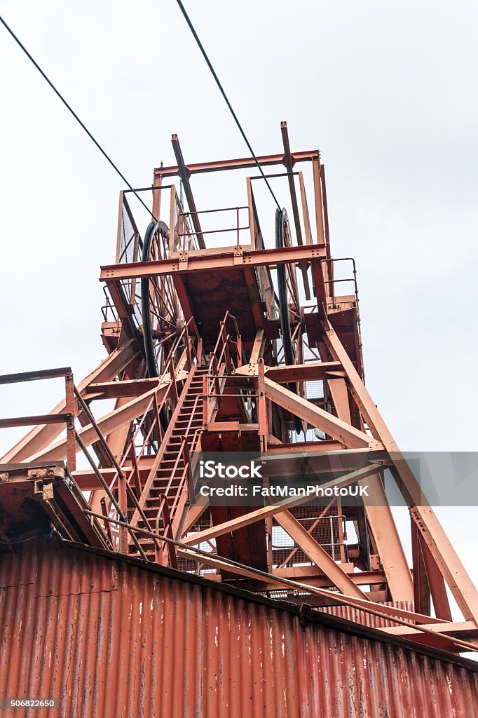 Coal mine head gear Red iron head gear of coal mine. Business Finance and Industry Stock Photo