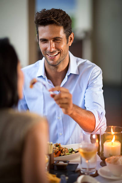 istock Young man feeding his beautiful girlfriend 506822956