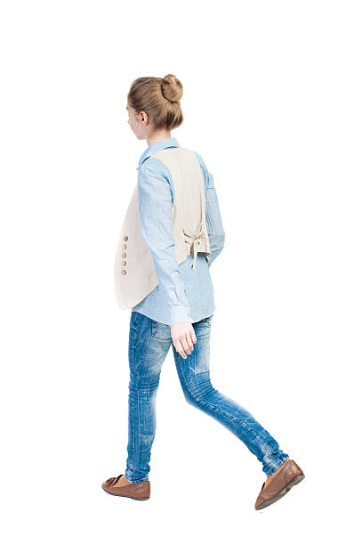 istock back view of walking  woman. 506823090