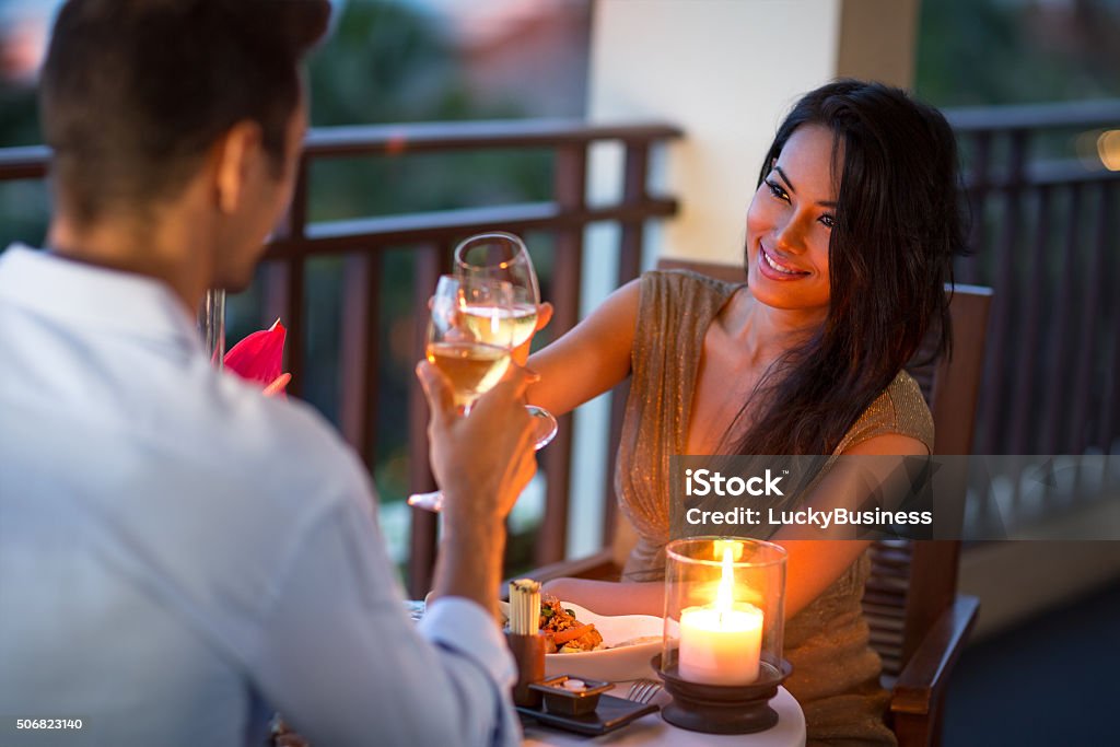 Couple having intimate dinner of summer evening Couple having intimate dinner for two on the terrace of summer evening Dating Stock Photo