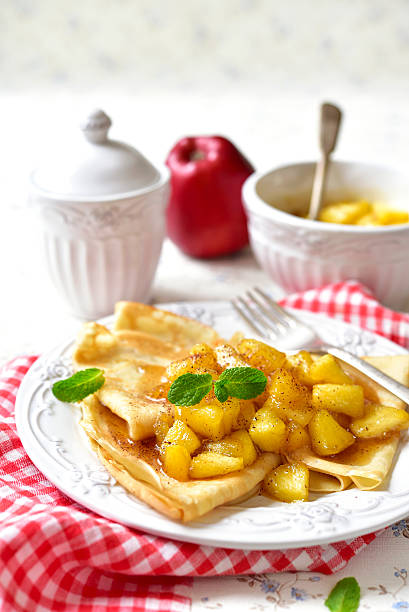 istock Thin pancakes with caramelised apples and cinnamon. 506823330