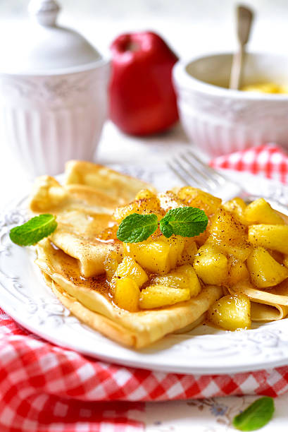 istock Thin pancakes with caramelised apples and cinnamon. 506823652