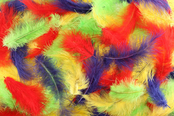 istock Background - small red, blue, green, yellow plumes situated irregularly 506823920