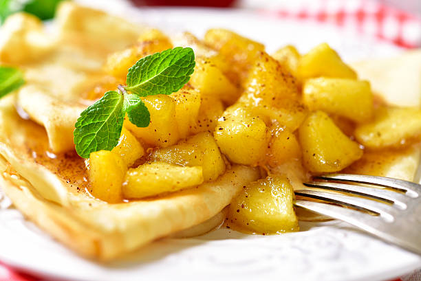 istock Thin pancakes with caramelised apples and cinnamon. 506824310