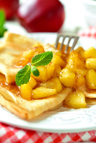 istock Thin pancakes with caramelised apples and cinnamon. 506824588
