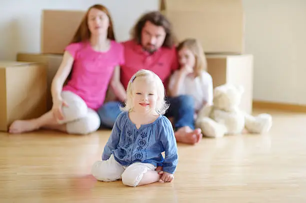 Photo of Happy little girl with in her new home